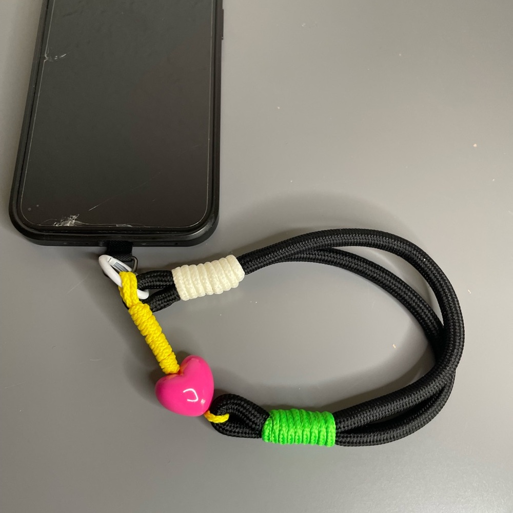 Black Phone Wrist Lanyard with Neon Accents and Pink Heart Bead